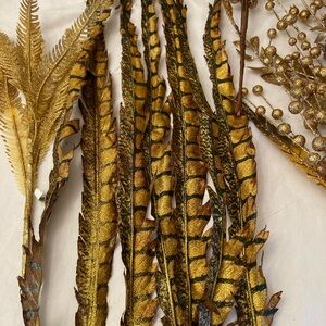 Gold and Brown Decorative Feathers and berries.